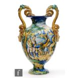 A late 19th to early 20th Century Cantagalli faience vase, decorated in the round with a hand