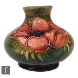 A small post war Walter Moorcroft vase of compressed ovoid form with collar neck, tubeline decorated