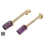 A pair of 18ct amethyst and diamond drop earrings, a line of eight brilliant cut diamonds falling to