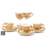A set of six Royal Worcester shape 1471 teacups and saucers, each decorated with fruits and
