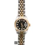 A lady's stainless steel and 18ct Rolex Oyster Perpetual Datejust with diamond set batons to a black