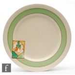 A Clarice Cliff circular plate circa 1932, hand painted in the Stroud pattern to the shoulder with a