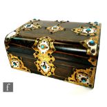 A 19th Century coromandel work box in the Gothic Revival style, with brass strapwork detail and