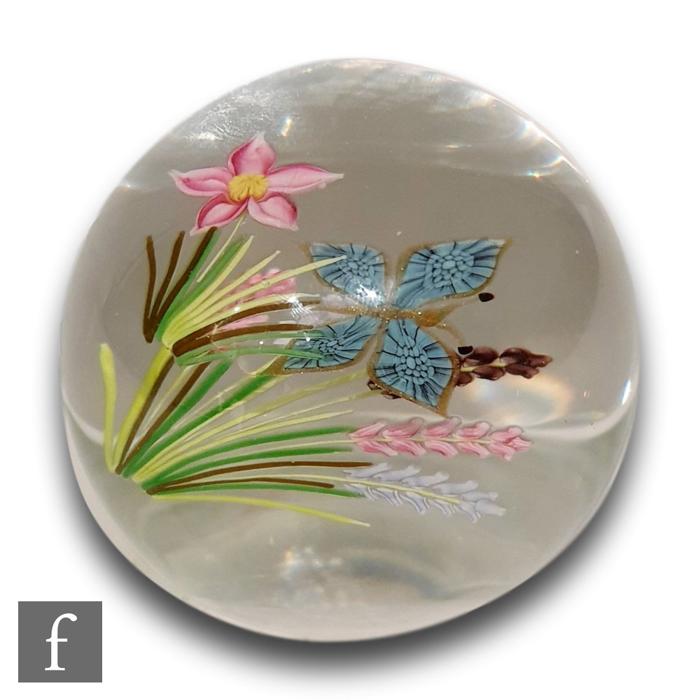 A Caithness glass Field study paperweight, internally decorated with pink and white meadow flowers