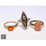 Three 9ct hallmarked single stone rings, a fire opal, an orange moonstone and a marquise cut
