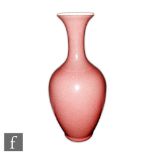 A Chinese 'Peachbloom' glazed vase of tapered bottle form, extending to a flared rim upper rim,