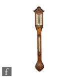 A late 19th Century figured and carved walnut stick barometer by Field & Son, New Street,