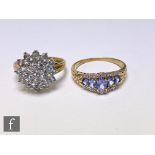 Two 9ct hallmarked tanzanite rings to included a cluster example and an example set with diamonds,