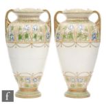 A pair of early to mid 20th Century Japanese twin handled vases decorated with a band of Art Nouveau