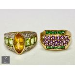 A 9ct amethyst and tsavorite ring set with three central rows of amethyst, with a peridot and