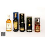A litre bottle of Remy Martin, a litre of Cutty sark emerald whisky, a litre of Chivas Regal, a