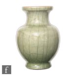 A Chinese late Qing Dynasty (1644-1912) Guan style crackle glaze vase, the bulbous vessel rising