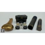 A small late 19th Century brass three drawer telescope, 44cm opened, a copper powder flask and a