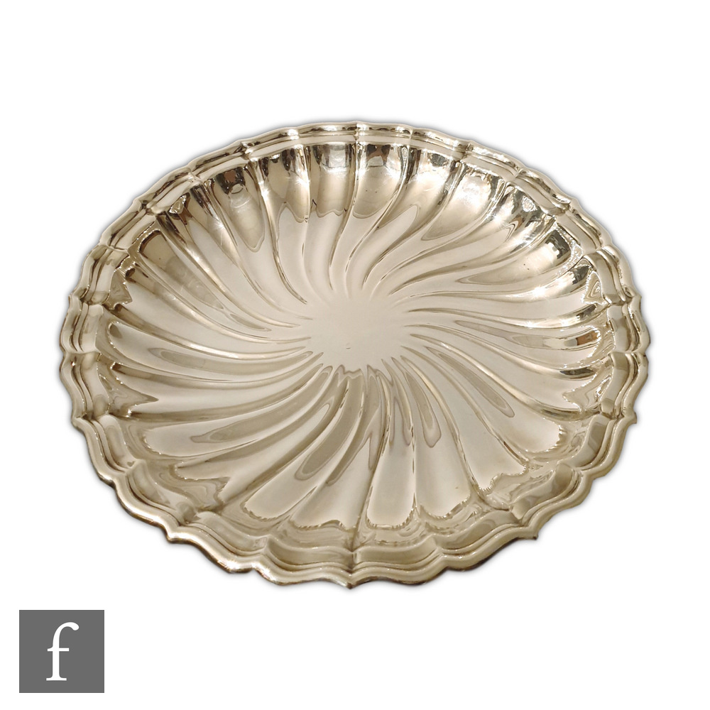 A large early 20th Century American sterling silver dish by Gorham, of wrythen fluted circular