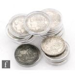 Fourteen replica American Morgan dollars. (14)