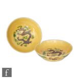 A pair of Chinese Guangxu (1875-1908) dishes, the vibrant yellow glazed dishes with aubergine and