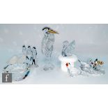 A collection of Swarovski bird ornaments comprising swallows, heron, swan, ducks, toucan also