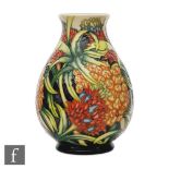 A Moorcroft Pottery vase of baluster form decorated in the Pineapple pattern designed by Kerry
