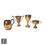 A hallmarked silver goblet with two small twin handled trophies and a pint tankard, total weight