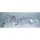 A collection of Swarovski figures of sea life theme comprising Annual Edition 1990 Lead Me Dolphins,