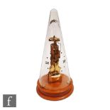 A late 20th Century Franz Hermle brass skeleton clock, the movement striking on a bell in conical