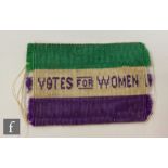 A small woven Edwardian Suffragette Votes for Women rectangular cloth clothing patch in the WSPU