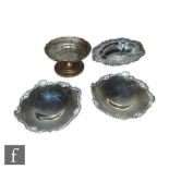 A collection of silver hallmarked items to include a pair of dishes of circular swept form,