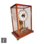 A mid 20th Century Bulle patent electric mantle clock, circular suspended dial over battery pendulum