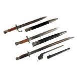 A 1913 Remington pattern bayonet, a similar bayonet, a Sanderson pattern bayonet and scabbard and