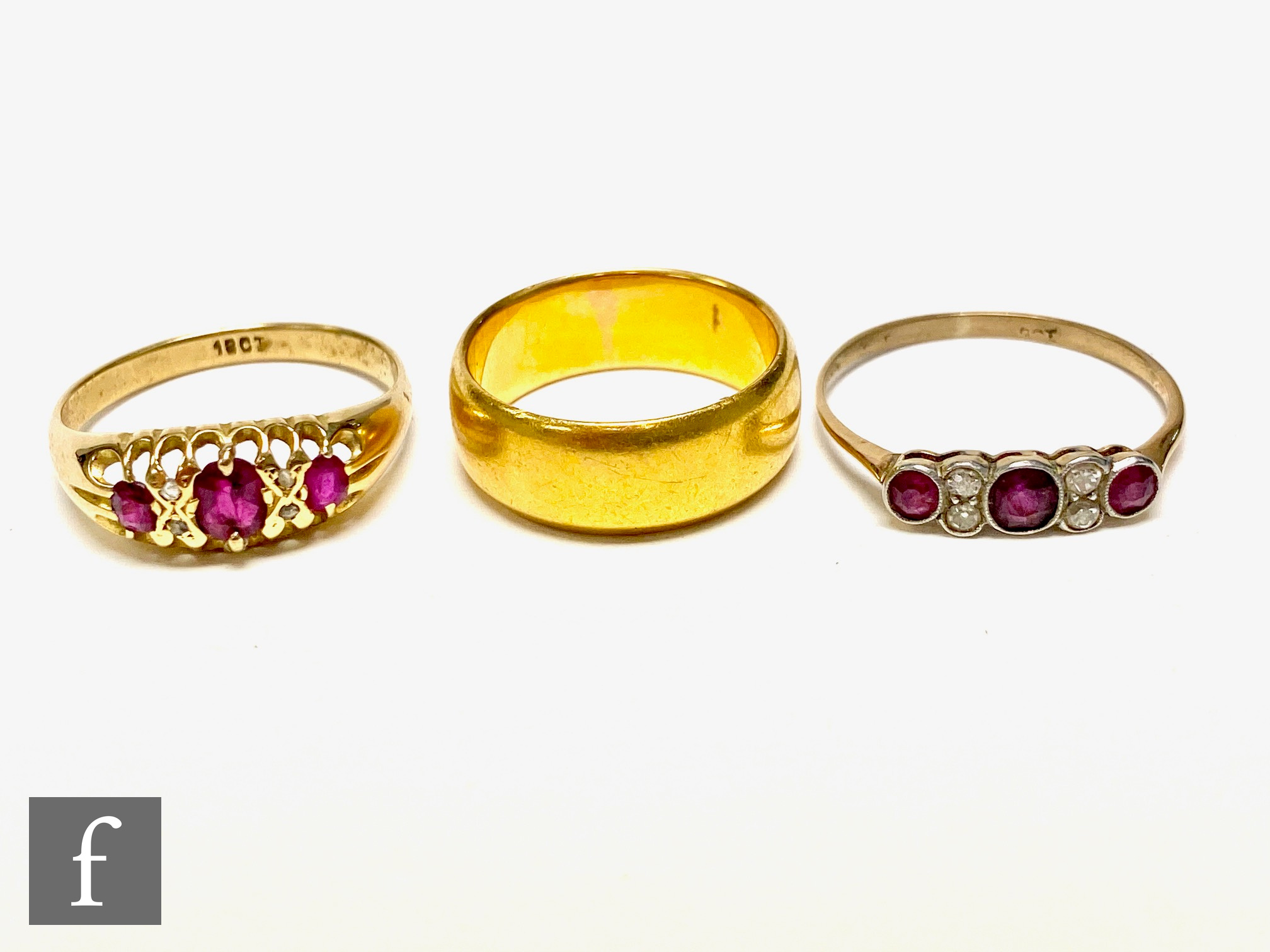 An early 20th Century 18ct ruby and diamond seven stone boat shaped ring, with a similar example