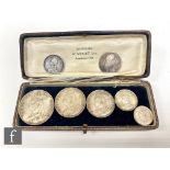 A Victoria 1887 five coin specimen set, another 1887 shilling and a Charles II 1668 shilling. (7)