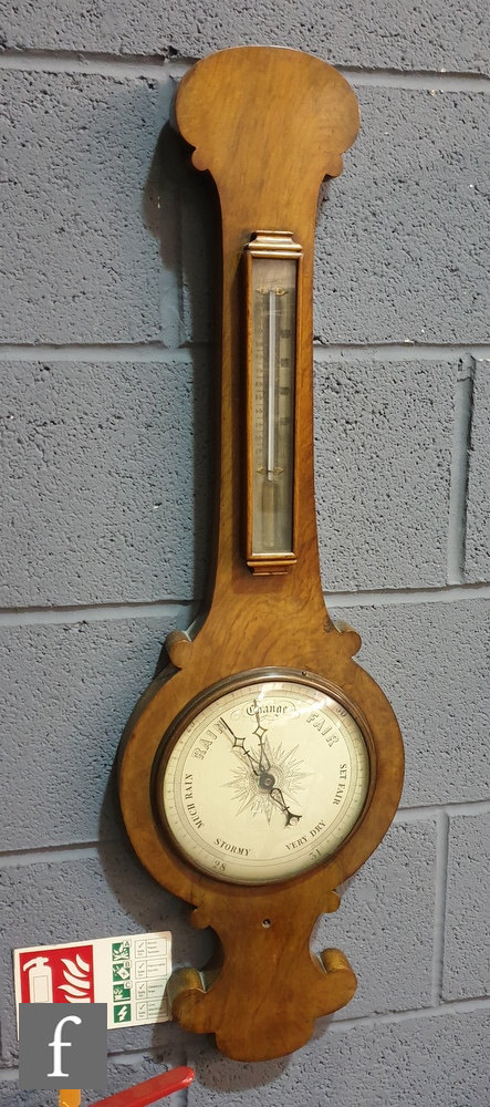 A 19th Century walnut wheel barometer incorporating a thermometer, height 92.5cm.