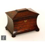 A 19th Century rosewood tea caddy of concave form fitted with two divisions, on bun feet, width
