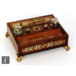 A 19th Century brass inlaid rosewood portable inkstand, fitted with two glass wells and central gilt