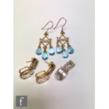 A pair of 9ct hallmarked blue topaz and diamond chandelier earrings with four diamond set above