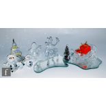 A collection of Swarovski Christmas themed ornaments comprising Father Christmas, Snowman and woman,