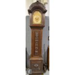 A 19th Century carved oak long case clock with three train movement the dial with three subsidiary