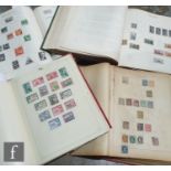 A collection of late 19th and early 20th Century world stamps contained in four albums, also