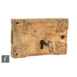 A 19th Century oak door lock of rectangular section with champhered edge and Gothic style iron