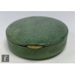 A 1930s French Art Deco shagreen powder compact of circular section with a hinged lid concealing a