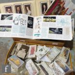 A large collection of cigarette, trade and tea cards to include Players, Wills, Champion etc.,