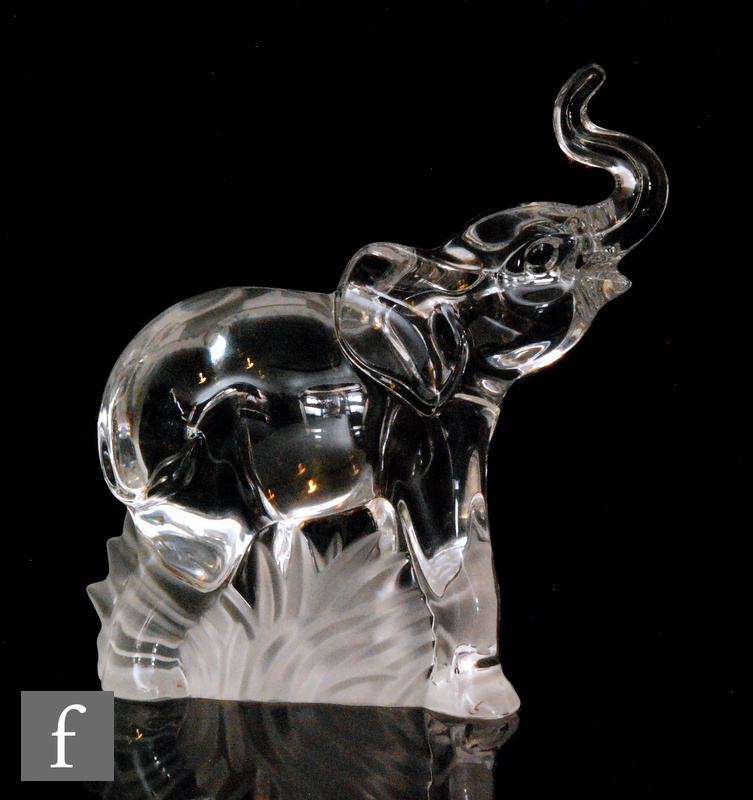 A later 20th Century Steuben clear crystal figure of an Elephant in walking pose with trunk