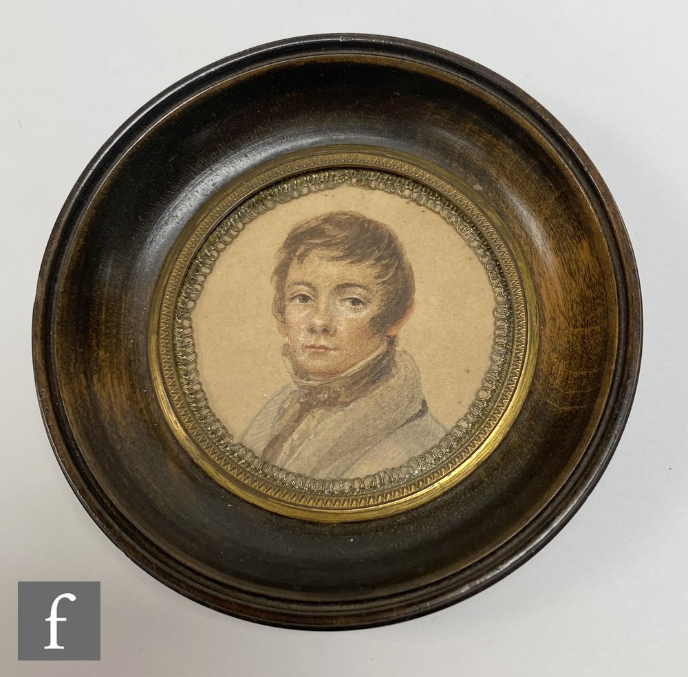 A small late 18th Century pastel portrait miniature of a young gentleman high collar shirt and