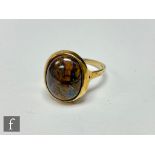 A 9ct hallmarked single stone boulder opal ring, collar set stone to plain shoulders, weight 5.3g,