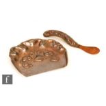 An early 20th Century Art Nouveau copper table crumb tray and brush with embossed decoration,