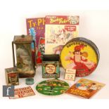A collection of early to mid 20th Century advertising memorabilia, including biscuit tins to include