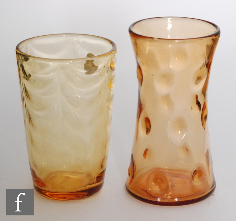 Two 1950s to 1960s golden amber glass vases, a Thomas Webb and Sons vase of waisted sleeve form in