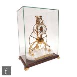 A late 20th Century brass single fusee skeleton clock, white enameled dial and large reverse wheel