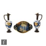 A pair of late 19th Century Doulton Aesthetic ewers decorated with mon motif and floral sprays,