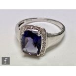 A 9ct hallmarked white gold blueberry quartz and diamond cluster ring, central quartz claw set to